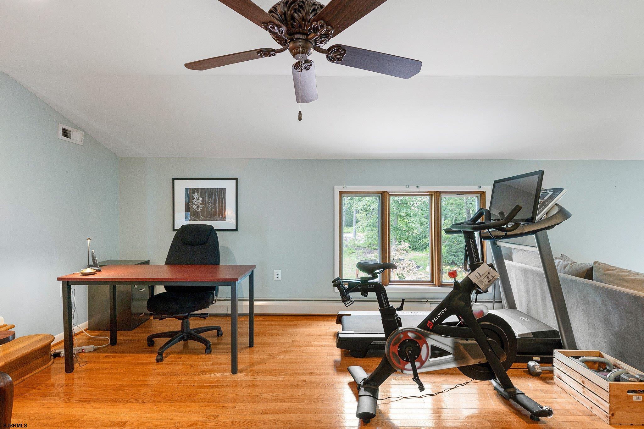108 Weatherby Road Mullica Hill, NJ 08062 - Photo 10 of 18 a view of a workspace with furniture and a window
