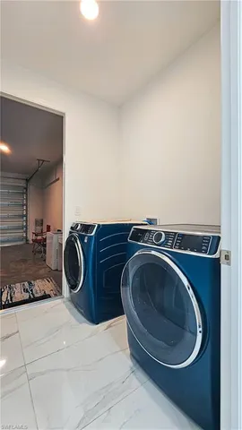a utility room with a washing machine