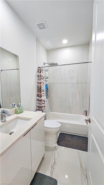 1503 West 17th Street Lehigh Acres, FL 33972 - Photo 18 of 26 a bathroom with a sink a toilet and shower