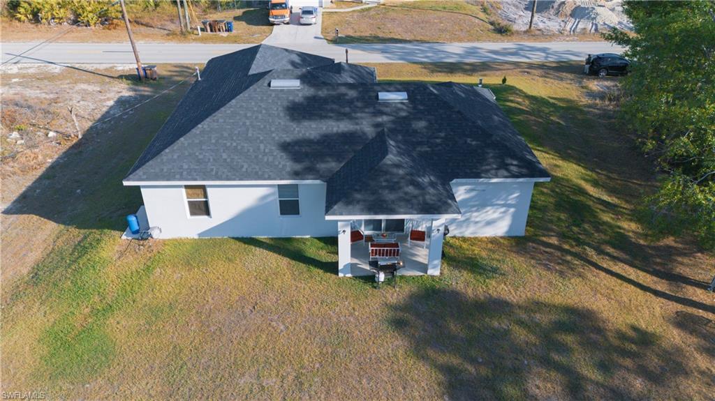 1503 West 17th Street Lehigh Acres, FL 33972 - Photo 26 of 26 a view of a house with a yard