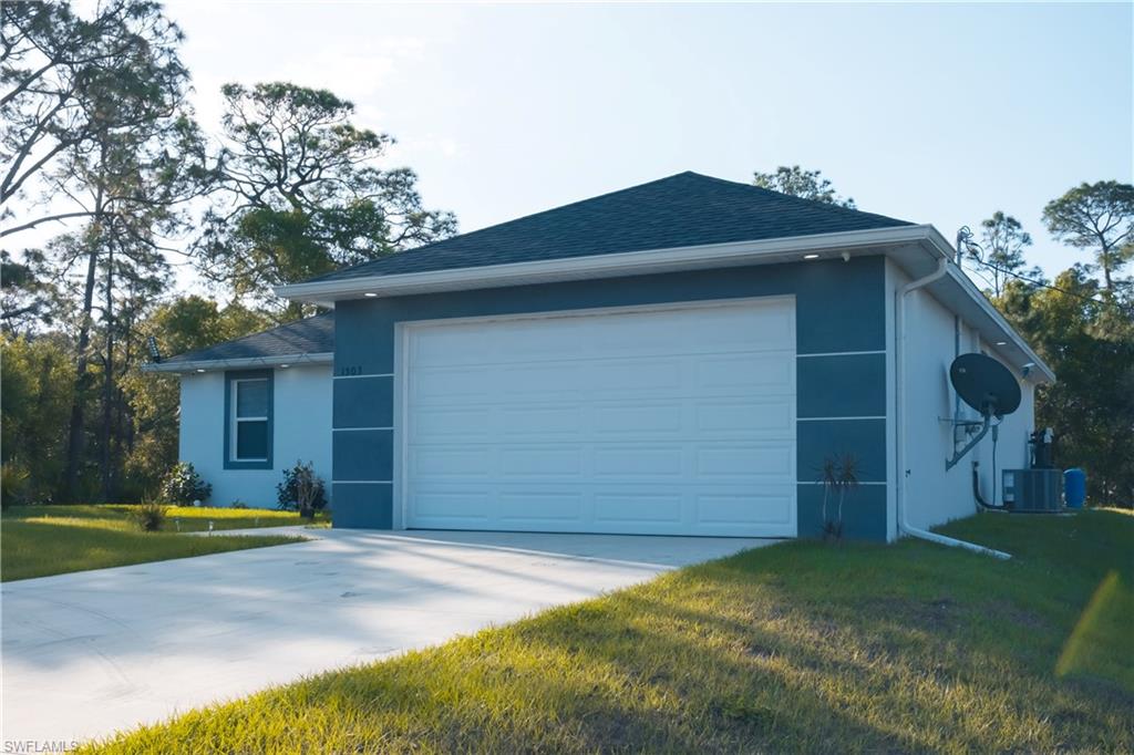 1503 West 17th Street Lehigh Acres, FL 33972 - Photo 3 of 26 a house view with a outdoor space