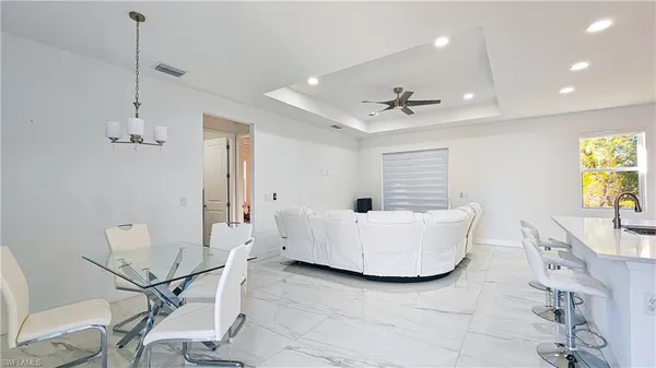 a living room with a window and a table