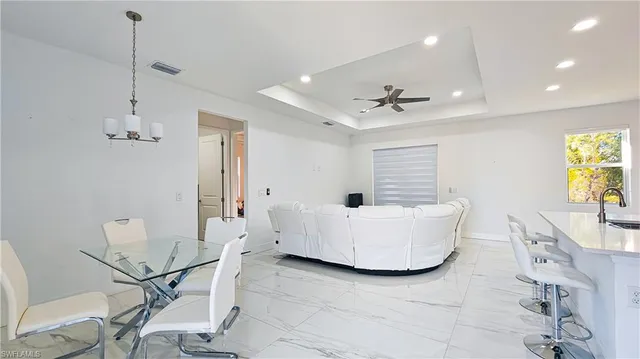 a living room with a window and a table