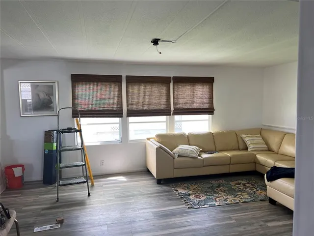 a kitchen with stainless steel appliances granite countertop a sink and a refrigerator