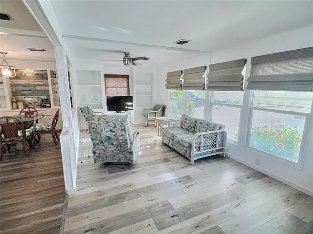 a bedroom with a bed and a television