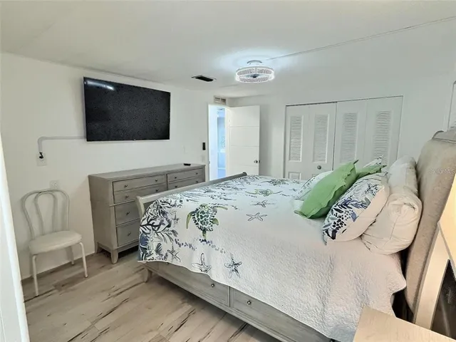 a bathroom with a toilet sink and a mirror