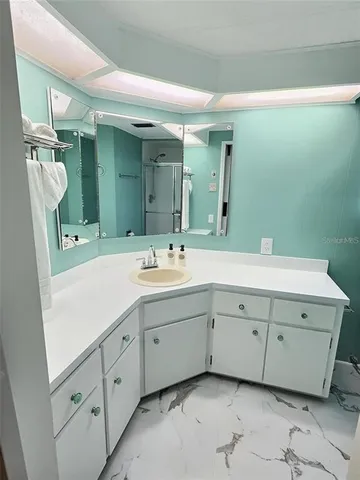 a bedroom with two beds and a window