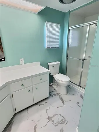 a bedroom with furniture and a wooden floor