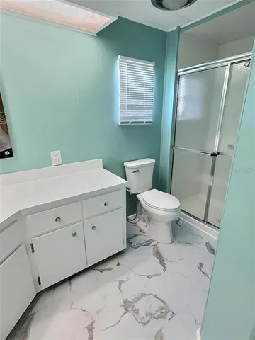 a bedroom with furniture and a wooden floor