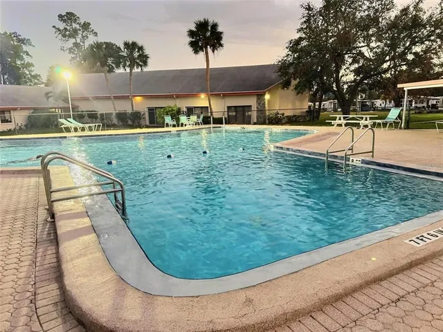 a view of a swimming pool with a garden