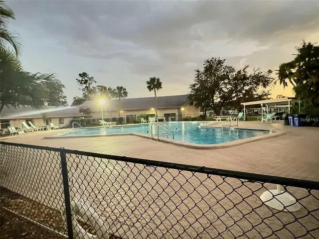 a view of swimming pool with a patio