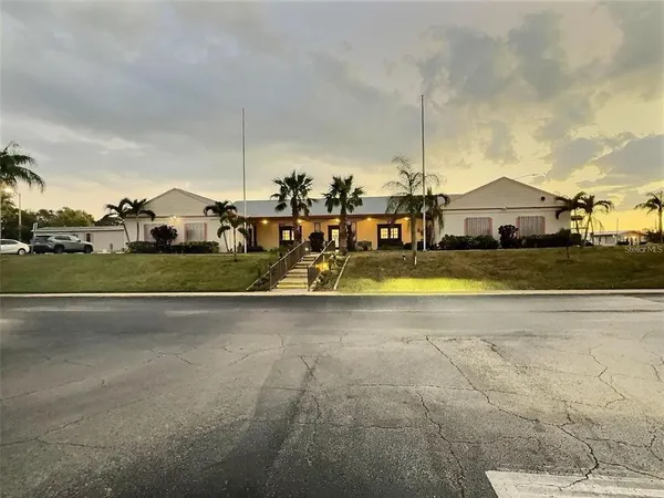a bedroom with furniture and a wooden floor