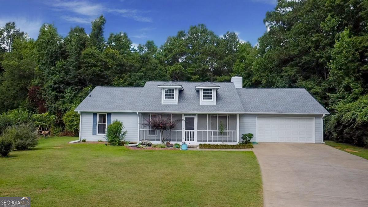 145 Deer Ridge Court McDonough, GA 30252 - Photo 1 of 54 a aerial view of a house with swimming pool and a yard