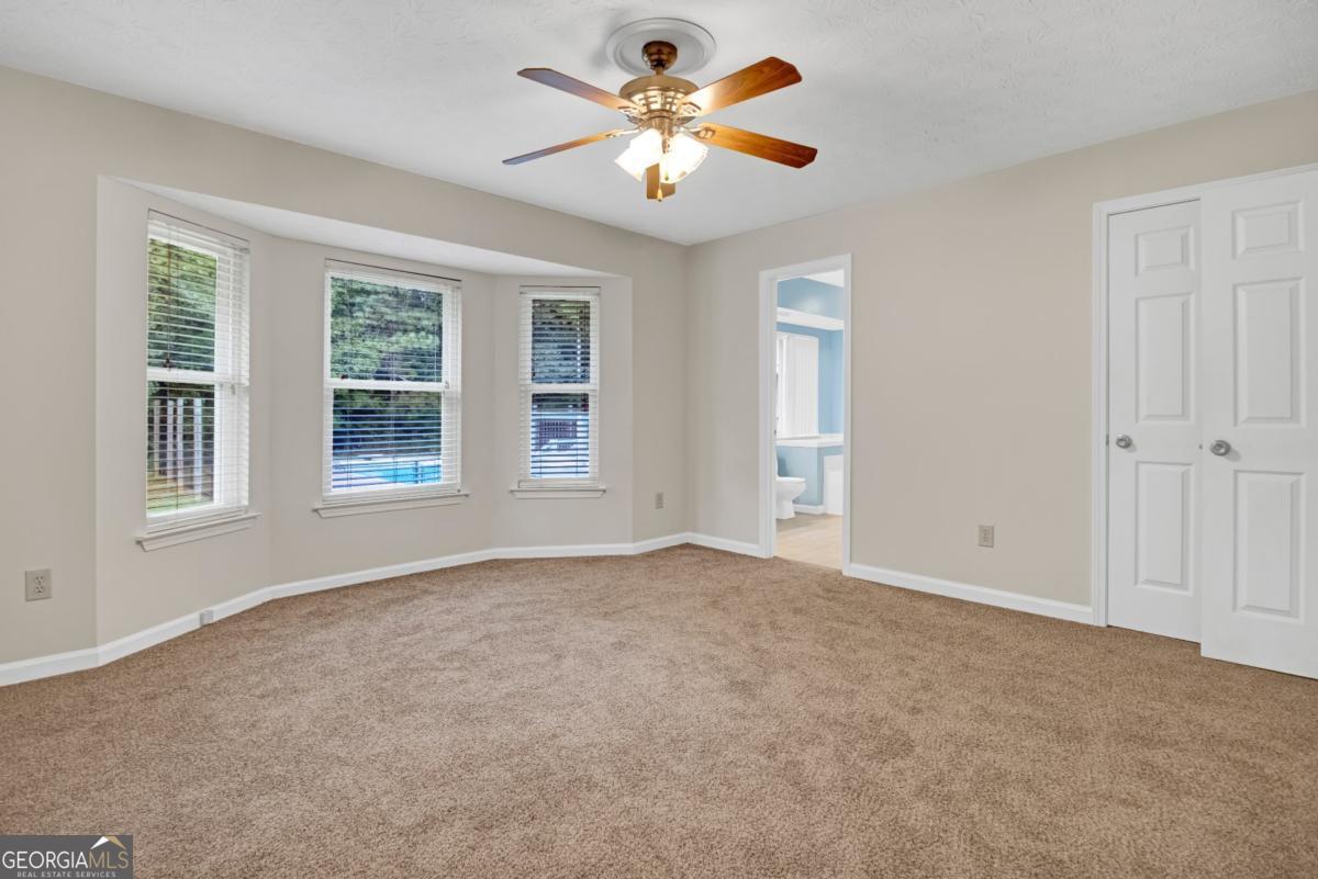 145 Deer Ridge Court McDonough, GA 30252 - Photo 21 of 54 a view of an empty room with a window