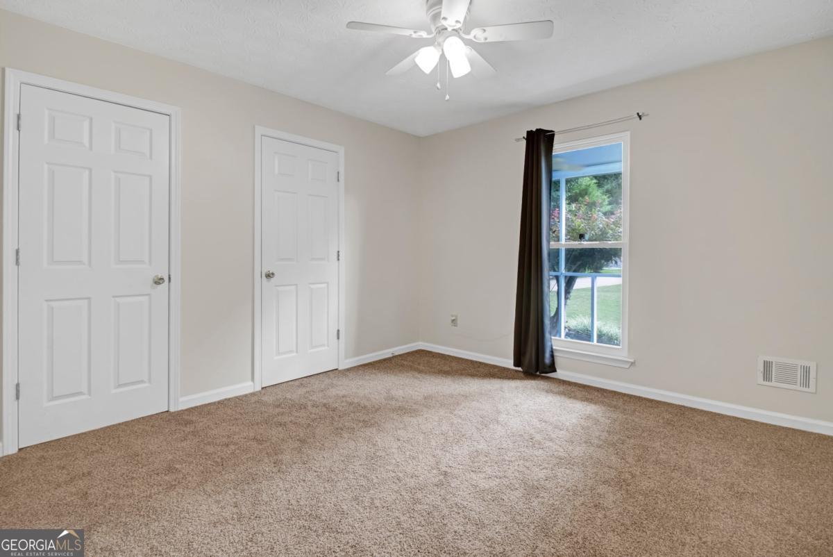 145 Deer Ridge Court McDonough, GA 30252 - Photo 28 of 54 a view of an empty room with a window