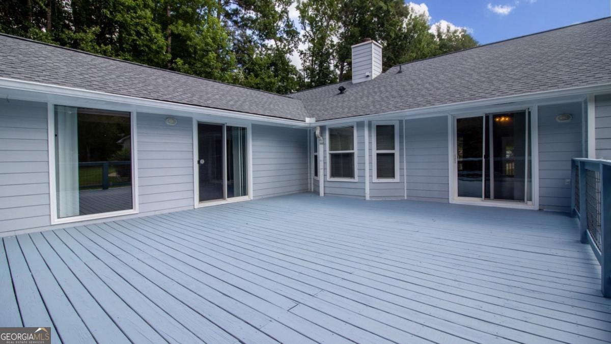 145 Deer Ridge Court McDonough, GA 30252 - Photo 38 of 54 a view of a house with wooden deck