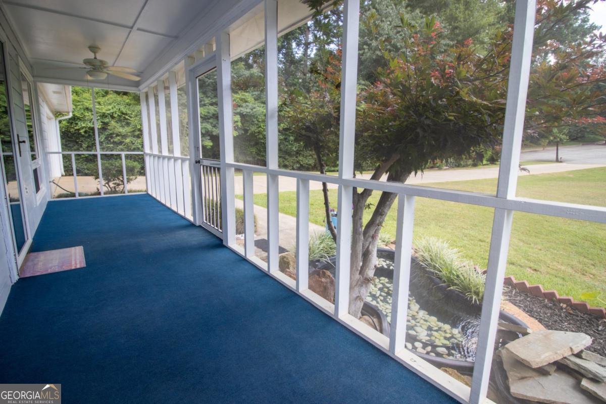 145 Deer Ridge Court McDonough, GA 30252 - Photo 4 of 54 a view of an empty room with wooden floor and windows