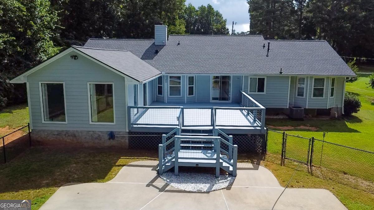 145 Deer Ridge Court McDonough, GA 30252 - Photo 45 of 54 a front view of a house with a garden