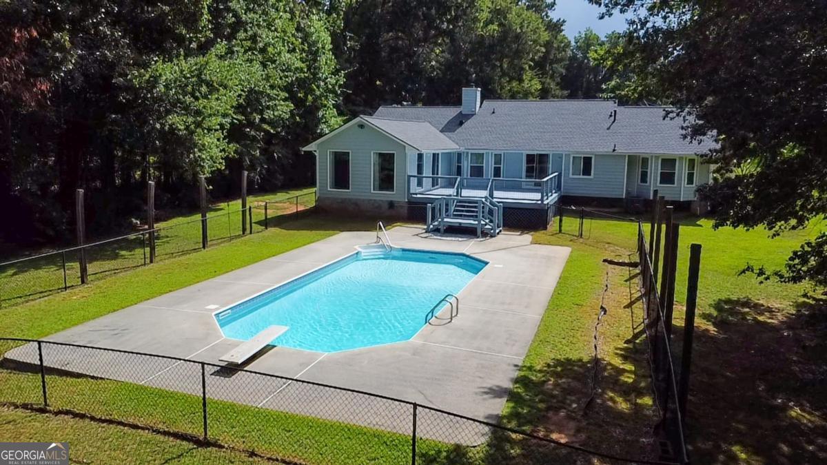 145 Deer Ridge Court McDonough, GA 30252 - Photo 47 of 54 a view of a house with swimming pool and sitting area