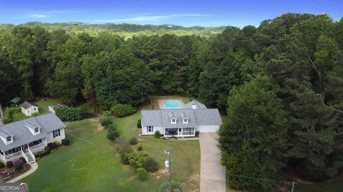 145 Deer Ridge Court McDonough, GA 30252 - Photo 50 of 54 an aerial view of a house with a yard