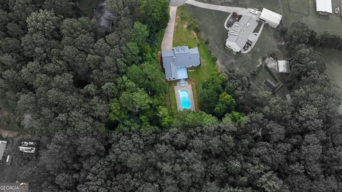 145 Deer Ridge Court McDonough, GA 30252 - Photo 53 of 54 an aerial view of house with outdoor space and covered with tall trees