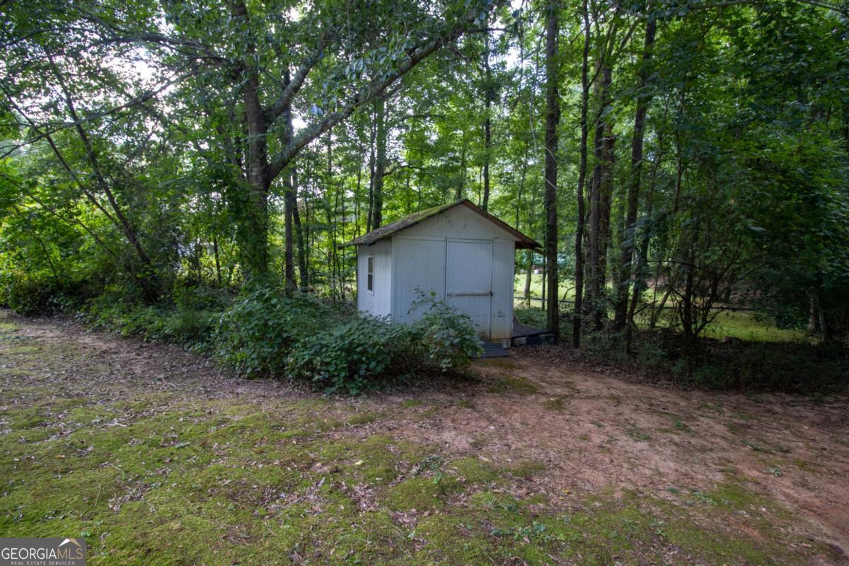145 Deer Ridge Court McDonough, GA 30252 - Photo 54 of 54 a view of a house with large trees