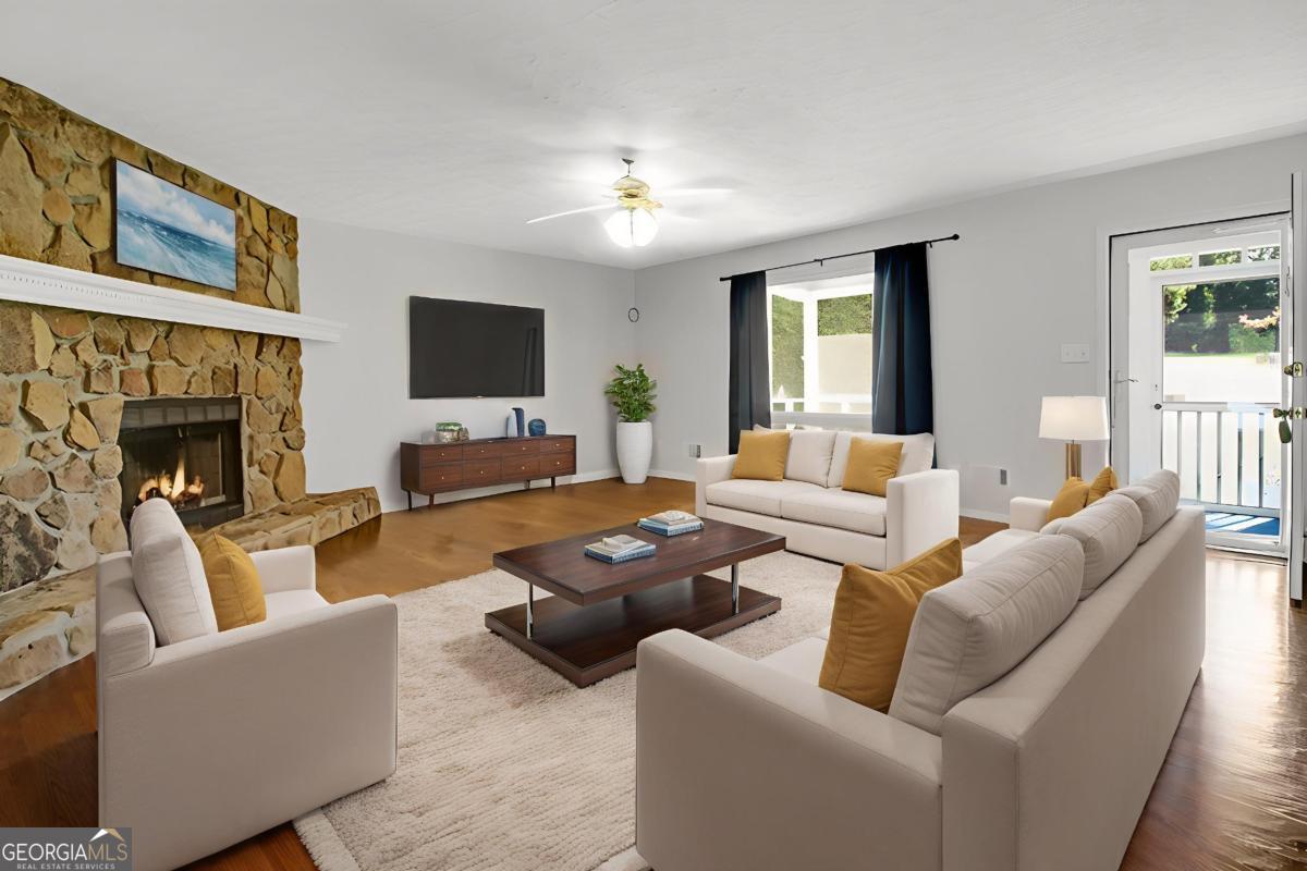 145 Deer Ridge Court McDonough, GA 30252 - Photo 7 of 54 a living room with furniture and a fireplace