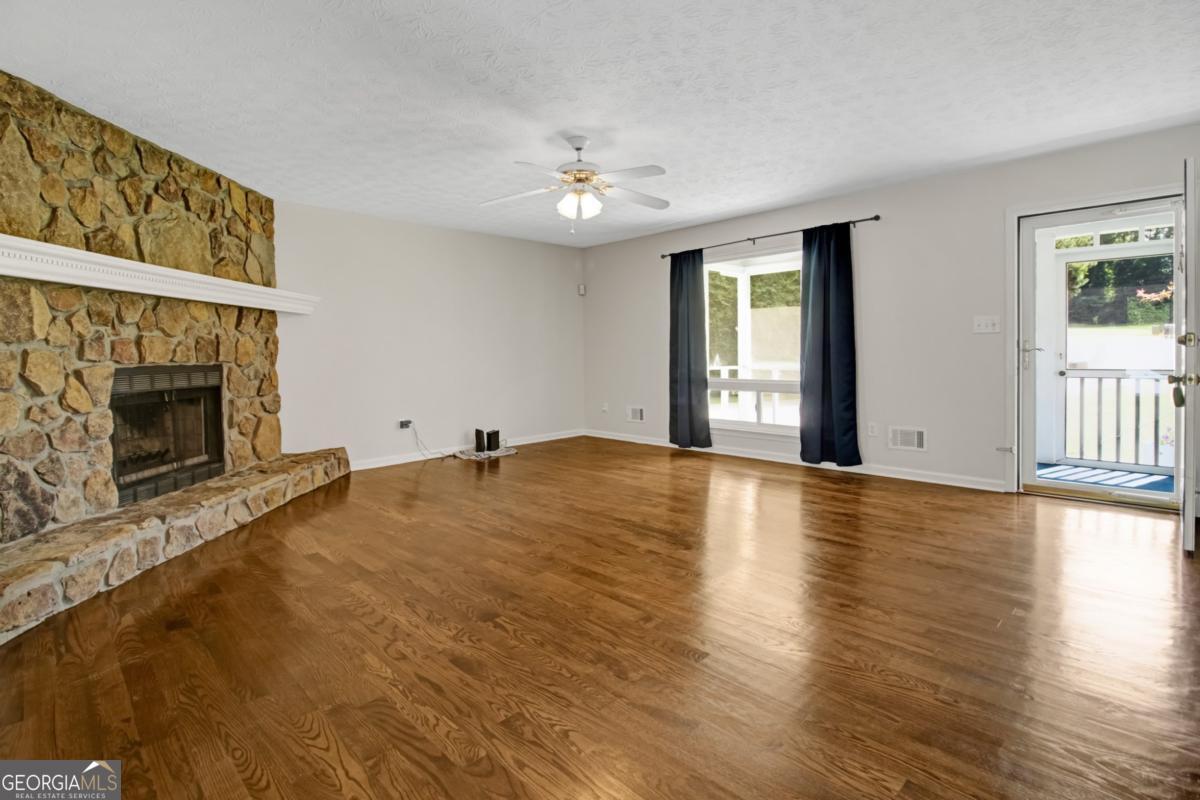 145 Deer Ridge Court McDonough, GA 30252 - Photo 8 of 54 a view of an empty room with window and fireplace