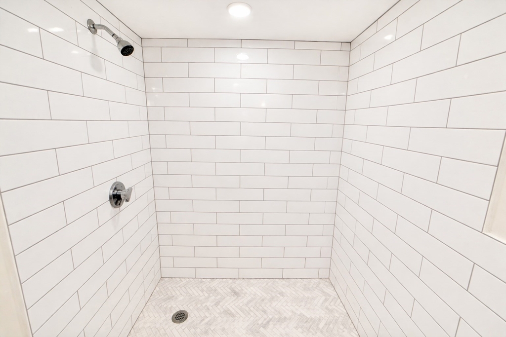 35 Foster Street, Unit A Boston, MA 02135 - Photo 14 of 16 a bathroom with a shower