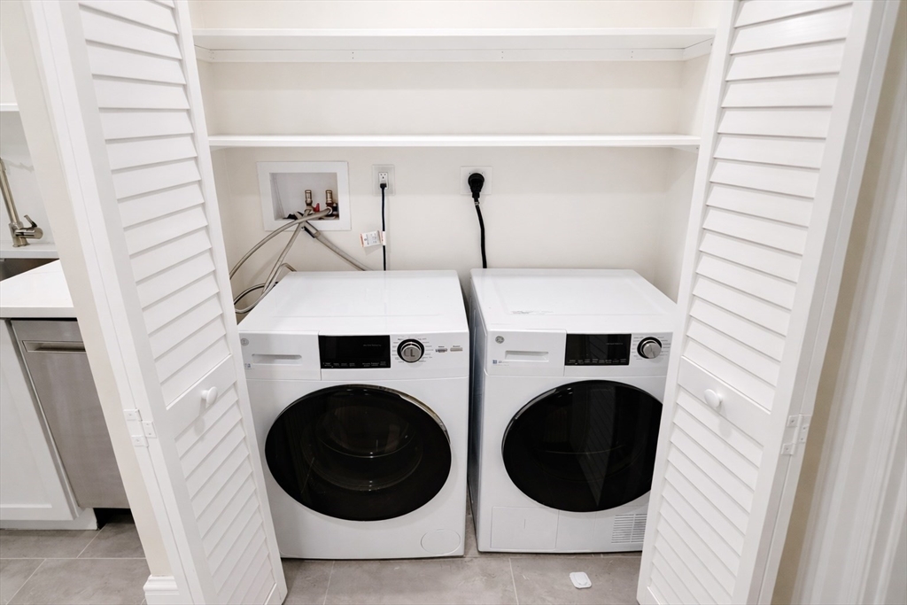 35 Foster Street, Unit A Boston, MA 02135 - Photo 15 of 16 a utility room with dryer and washer