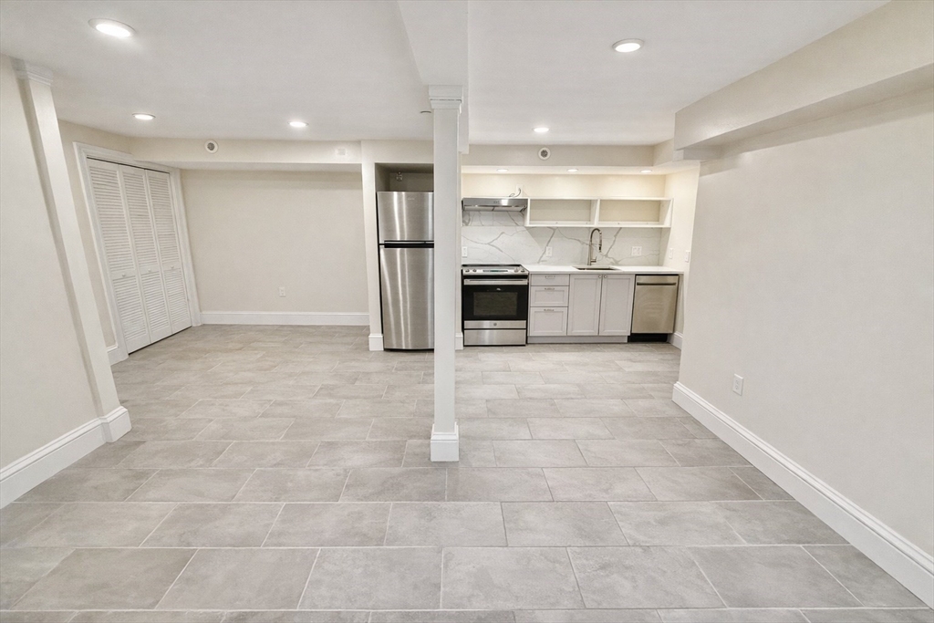 35 Foster Street, Unit A Boston, MA 02135 - Photo 6 of 16 a view of kitchen with stainless steel appliances refrigerator and cabinets