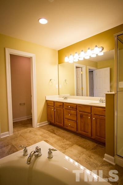 8027 Satillo Lane Raleigh, NC 27616 - Photo 15 of 25 Separate tub and shower in this large master bath.