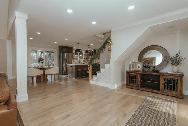 a view of living room and kitchen with stainless steel appliances