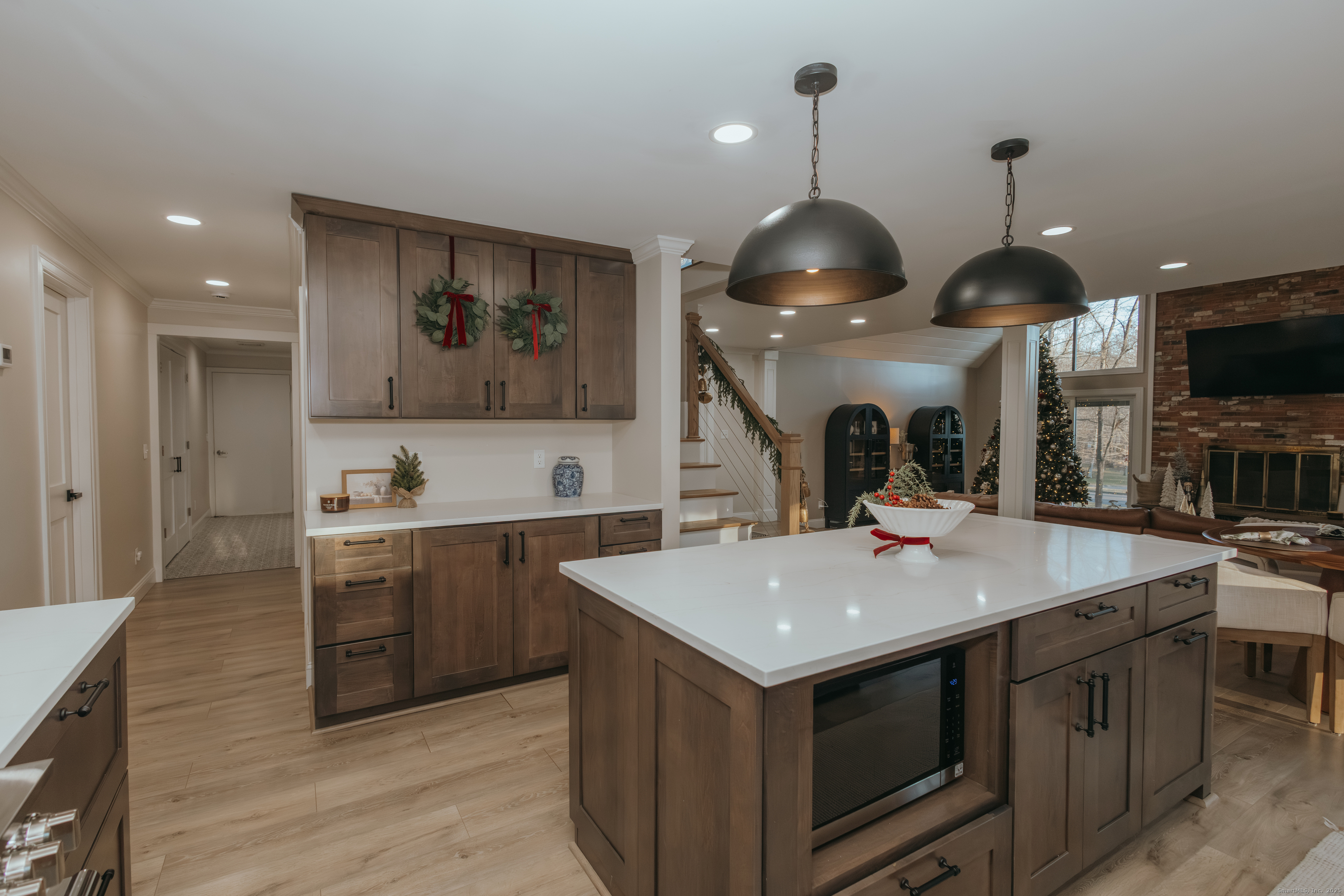 4 Moss Lane Wolcott, CT 06716 - Photo 18 of 40 a kitchen with stainless steel appliances granite countertop a sink a stove and a wooden floors