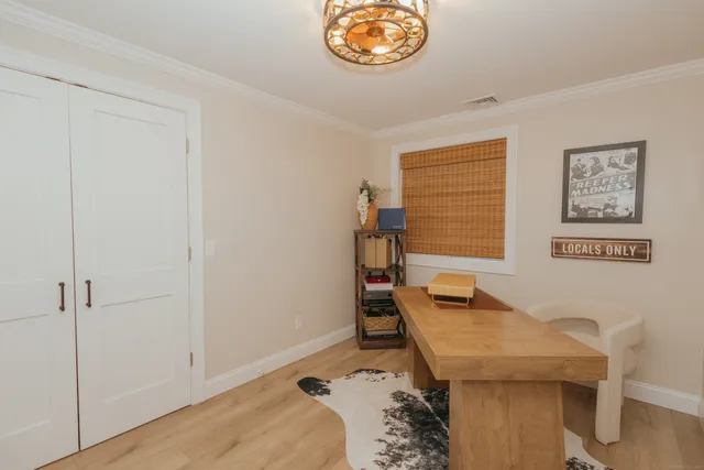 a view of a bedroom with a bed and toys