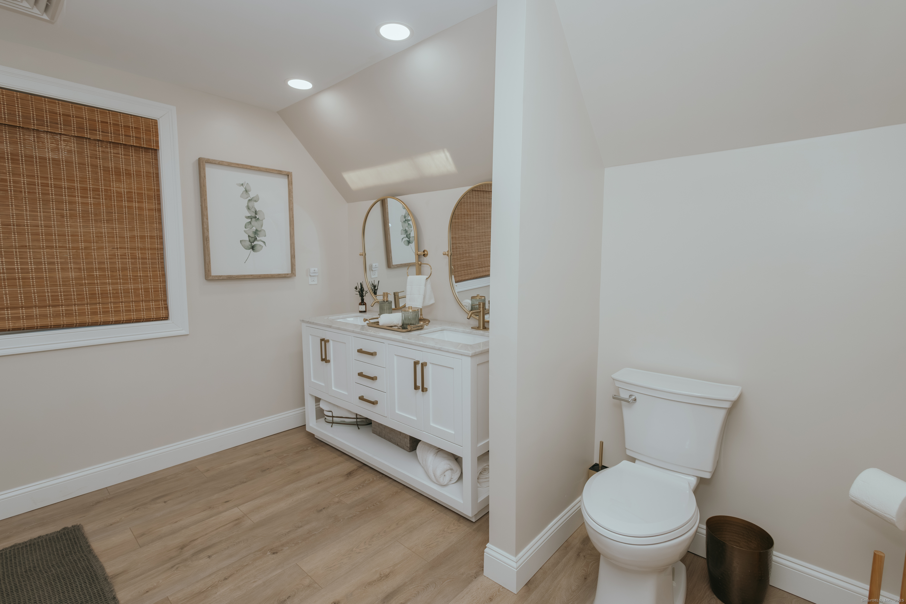 4 Moss Lane Wolcott, CT 06716 - Photo 35 of 40 a bathroom with a toilet sink and mirror