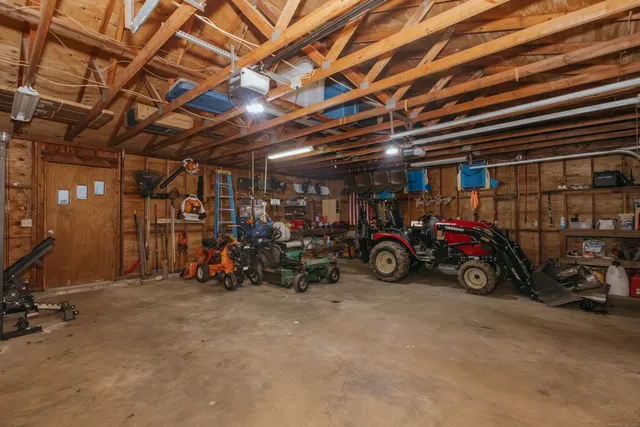a view of a garage with a bike and wooden roof