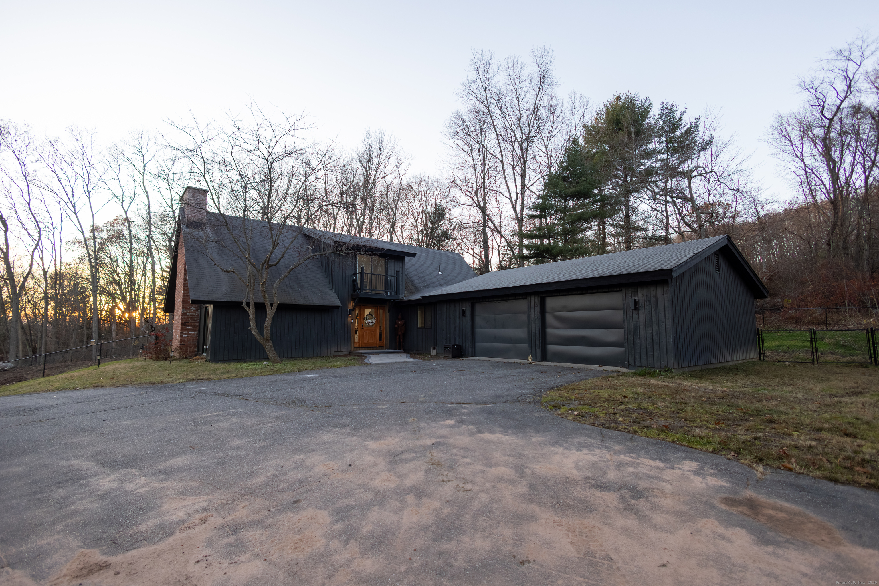 4 Moss Lane Wolcott, CT 06716 - Photo 6 of 40 a view of a house with a yard and garage