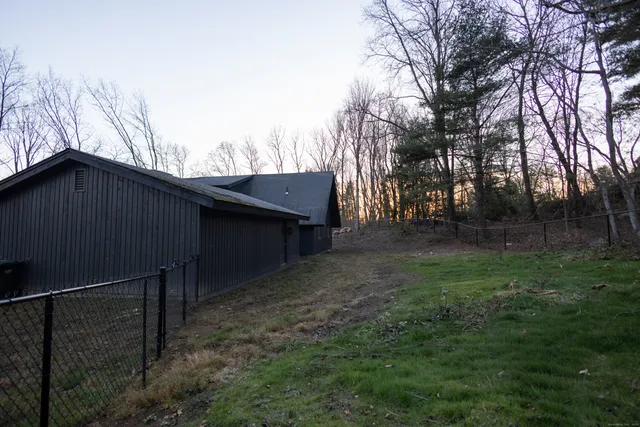 a backyard of a house with lots of green space