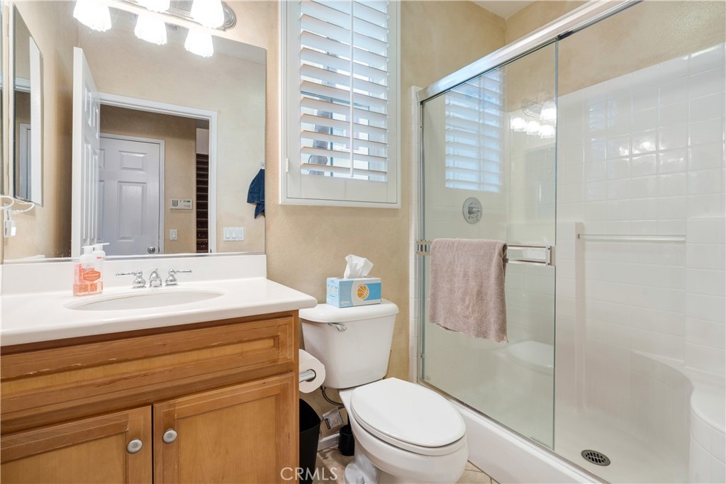 56 Freeland Irvine, CA 92602 - Photo 11 of 28 a bathroom with a sink a toilet and shower