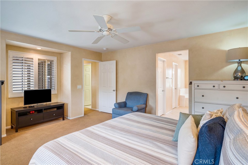 56 Freeland Irvine, CA 92602 - Photo 19 of 28 a bedroom with a bed and a flat tv screen on dresser