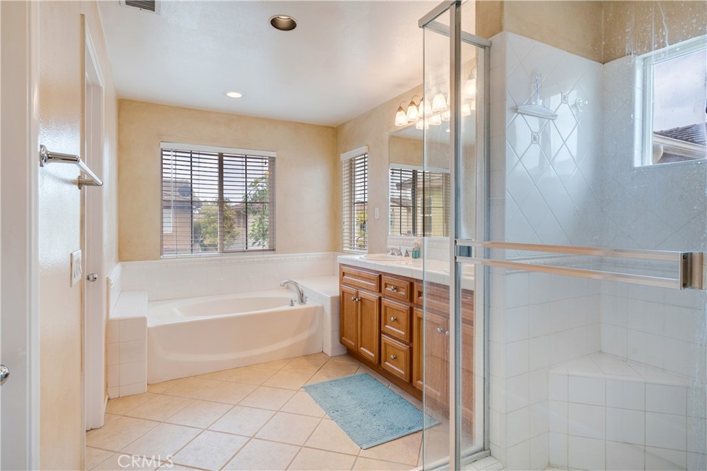 56 Freeland Irvine, CA 92602 - Photo 20 of 28 a spacious bathroom with a tub shower and sink