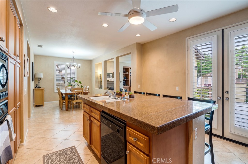 56 Freeland Irvine, CA 92602 - Photo 10 of 28 a kitchen with a stove a refrigerator and a dining table