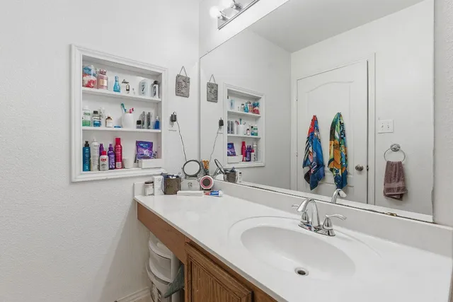 a bathroom with a sink and a mirror