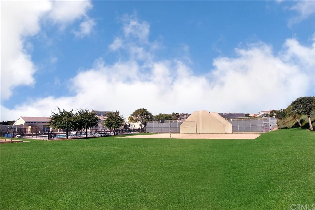 23741 Perth Bay Dana Point, CA 92629 - Photo 16 of 25 a view of yard with grass and trees in the background