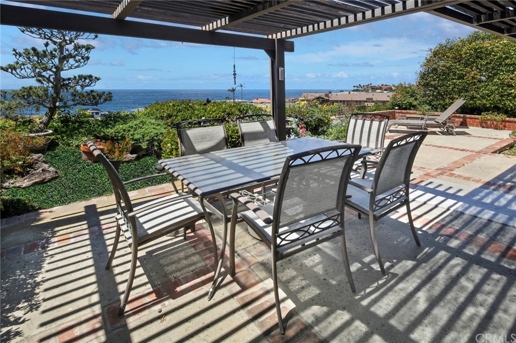 23741 Perth Bay Dana Point, CA 92629 - Photo 2 of 25 a view of a patio with a table chairs and a yard