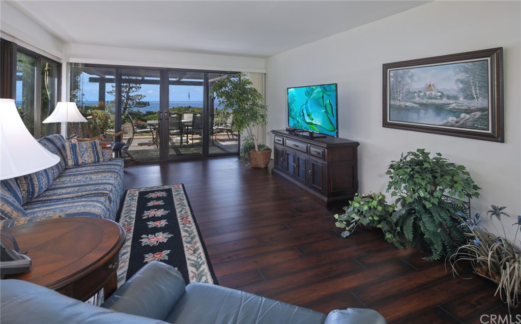 23741 Perth Bay Dana Point, CA 92629 - Photo 4 of 25 a living room with furniture and a large window