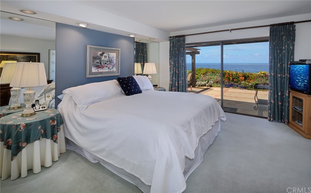 23741 Perth Bay Dana Point, CA 92629 - Photo 7 of 25 a spacious bedroom with a bed and a large window