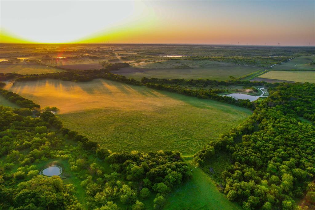 a view of an ocean and a mountain