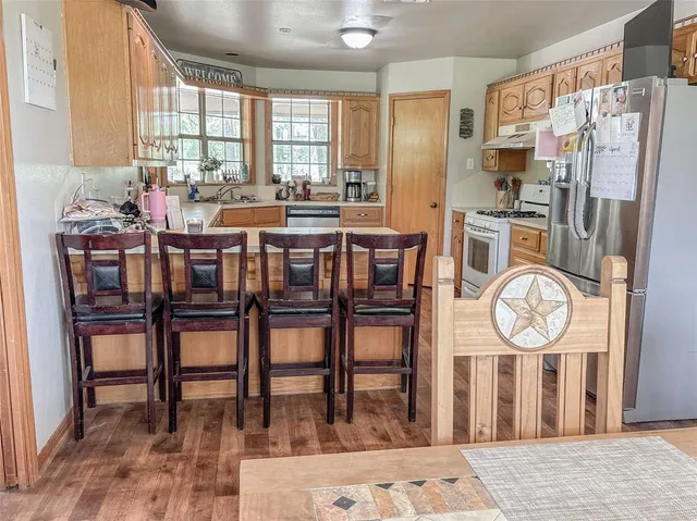 a very nice looking dining room with a table and chairs